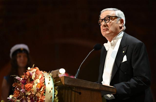 laureate of The Sveriges Riksbank Prize in Economic Sciences 2025 US-Israeli economic historian Joel Mokyr addresses a speech at the end of the Nobel Prize banquet on December 10, 2025 at the City Hall in Stockholm, Sweden. The laureates received their prizes at formal ceremonies in Stockholm and Oslo on December 10. That date is the anniversary of the death in 1896 of scientist Alfred Nobel, who created the prizes in his will. (Photo by Jonathan Nackstrand / AFP)
