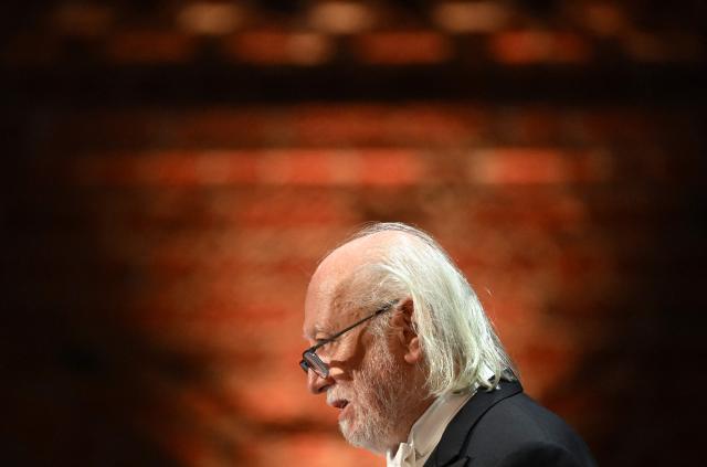 Nobel Prize in Literature 2025 laureate Hungarian writer Laszlo Krasznahorkai addresses a speech at the end of the Nobel Prize banquet on December 10, 2025 at the City Hall in Stockholm, Sweden. The laureates received their prizes at formal ceremonies in Stockholm and Oslo on December 10. That date is the anniversary of the death in 1896 of scientist Alfred Nobel, who created the prizes in his will. (Photo by Jonathan Nackstrand / AFP)