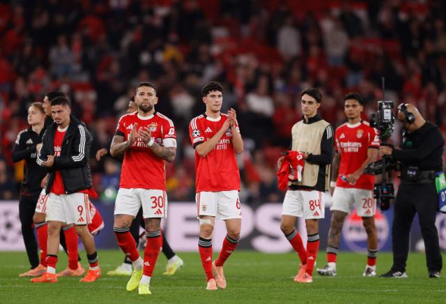 Benfica's Argentine defender #30 Nicolas Otamendi and Portuguese defender #62 Jose Neto reacst at the end of the UEFA Champions League league phase day 6 football match between SL Benfica and Napoli at Estadio da Luz in Lisbon on December 10, 2025. (Photo by FILIPE AMORIM / AFP)