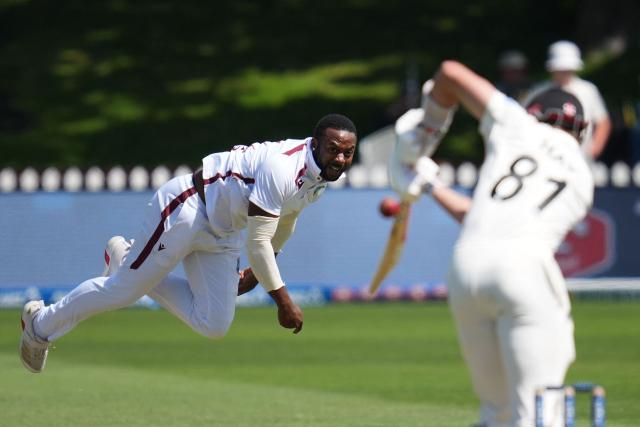 West Indies' Ojay Shields bowls during day two of the 2nd international Test cricket match between New Zealand and West Indies at the Basin reserve in Wellington on December 11, 2025. (Photo by Marty MELVILLE / AFP)