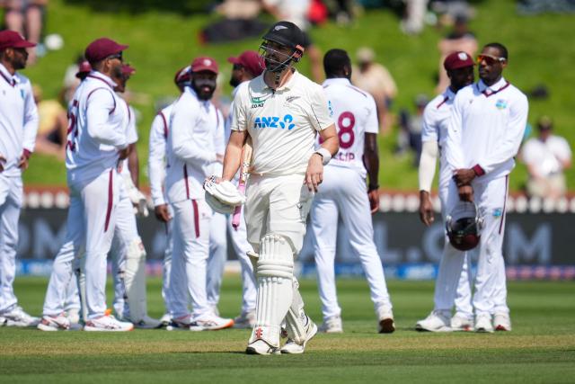 New Zealand's Daryl Mitchell walks from the field after being caught during day two of the 2nd international Test cricket match between New Zealand and West Indies at the Basin reserve in Wellington on December 11, 2025. (Photo by Marty MELVILLE / AFP)