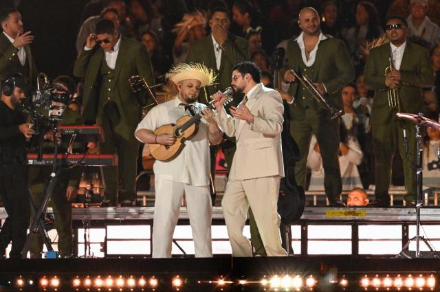 Puerto Rican rapper Bad Bunny performs on stage during his "Debi tirar mas fotos" world tour in Mexico City on December 10, 2025. (Photo by Alfredo ESTRELLA / AFP)