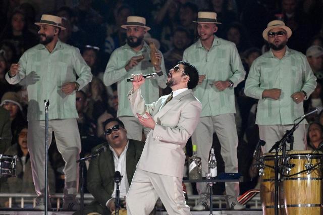 Puerto Rican rapper Bad Bunny performs on stage during his "Debi tirar mas fotos" world tour in Mexico City on December 10, 2025. (Photo by Alfredo ESTRELLA / AFP)