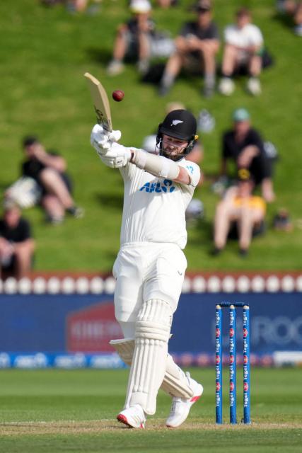 New Zealand's Michael Rae plays a shot during day two of the 2nd international Test cricket match between New Zealand and West Indies at the Basin reserve in Wellington on December 11, 2025. (Photo by Marty MELVILLE / AFP)
