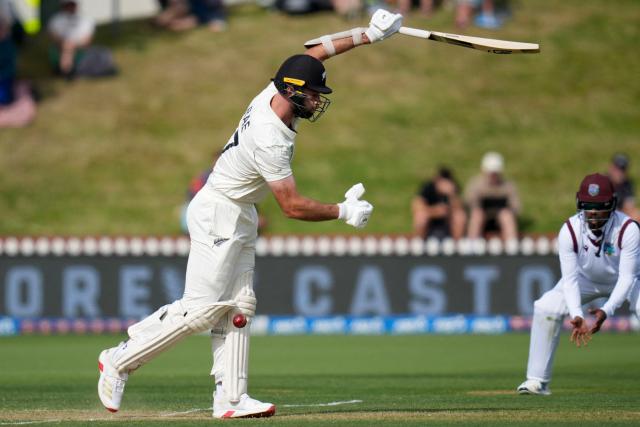 New Zealand's Michael Rae is bowled during day two of the 2nd international Test cricket match between New Zealand and West Indies at the Basin reserve in Wellington on December 11, 2025. (Photo by Marty MELVILLE / AFP)