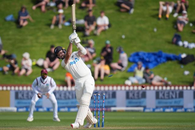 New Zealand's Michael Rae is bowled during day two of the 2nd international Test cricket match between New Zealand and West Indies at the Basin reserve in Wellington on December 11, 2025. (Photo by Marty MELVILLE / AFP)