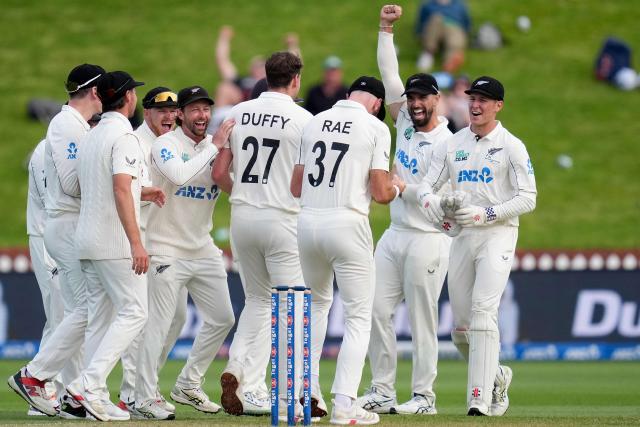 New Zealand players celebrate West Indies' Anderson Phillip being caught with LBW during day two of the 2nd international Test cricket match between New Zealand and West Indies at the Basin reserve in Wellington on December 11, 2025. (Photo by Marty MELVILLE / AFP)