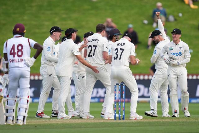 New Zealand players celebrate West Indies' Anderson Phillip (L) being caught with LBW during day two of the 2nd international Test cricket match between New Zealand and West Indies at the Basin reserve in Wellington on December 11, 2025. (Photo by Marty MELVILLE / AFP)