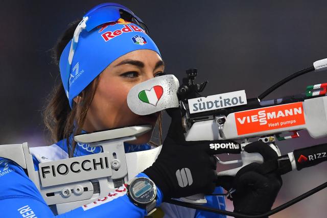 (FILES) Italy's Dorothea Wierer warms up at the shooting range prior to the women's 7,5km sprint event of the IBU Biathlon World Championships in Nove Mesto, Czech Republic on February 9, 2024. Competing in the Olympic Games at home, just a few kilometers from her childhood home, could be the pinnacle of Dorothea Wierer’s career, but the 2026 Olympics may be arriving too late for the 35-year-old Italian biathlete. (Photo by Michal Cizek / AFP)