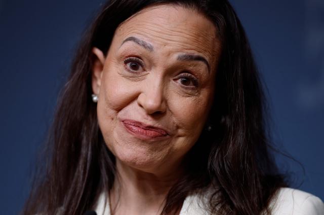 Nobel Peace Prize winner Maria Corina Machado addresses a press conference on December 11, 2025 at the Norwegian government's representative facilities in Oslo. Machado arrived in the Norwegian capital hours after the Venezuelan opposition leader's award was collected on her behalf by her daughter. (Photo by Odd ANDERSEN / AFP)