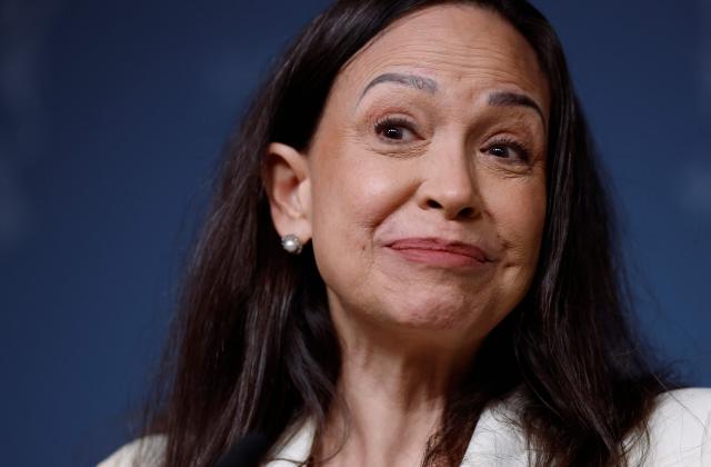 Nobel Peace Prize winner Maria Corina Machado addresses a press conference on December 11, 2025 at the Norwegian government's representative facilities in Oslo. Machado arrived in the Norwegian capital hours after the Venezuelan opposition leader's award was collected on her behalf by her daughter. (Photo by Odd ANDERSEN / AFP)