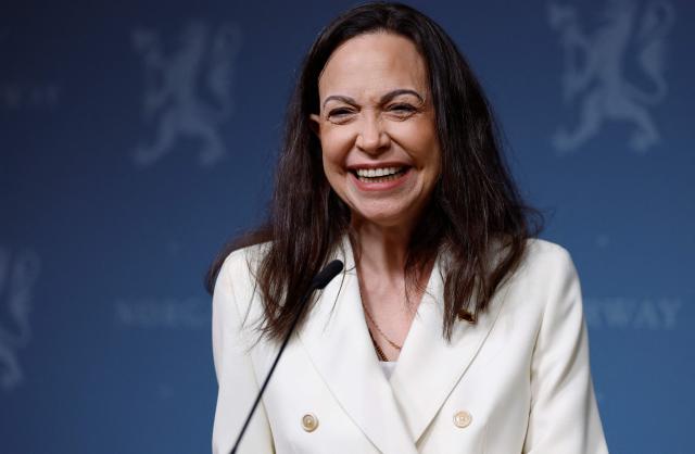 Nobel Peace Prize winner Maria Corina Machado smiles during a press conference on December 11, 2025 at the Norwegian government's representative facilities in Oslo. Machado arrived in the Norwegian capital hours after the Venezuelan opposition leader's award was collected on her behalf by her daughter. (Photo by Odd ANDERSEN / AFP)