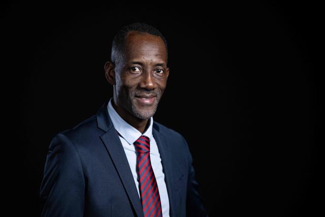 La France Insoumise (LFI) candidate for mayor of Saint Denis, Bally Bagayoko poses during a photo session in Paris, on December 11, 2025. (Photo by JULIEN DE ROSA / AFP)