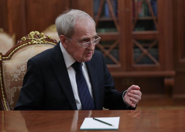 In this pool photograph distributed by the Russian state agency Sputnik, the Constitutional Court Chairman Valery Zorkin attends a meeting with Russia's President at the Kremlin in Moscow on December 11, 2025. (Photo by Gavriil Grigorov / POOL / AFP)