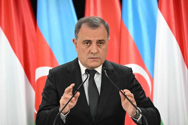 Azerbaijan's Foreign Minister Jeyhun Bayramov addresses a joint press conference with his Hungarian counterpart in the Bozsik Arena of Budapest, on December 11, 2025. Bayramov pays a working visit to the Hungarian capital, including meetings with Hungarian officials and the third Azerbaijan–Hungary Strategic Dialogue. (Photo by Attila KISBENEDEK / AFP)