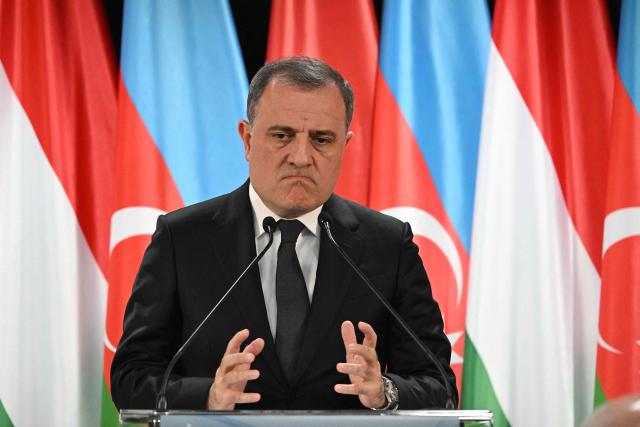 Azerbaijan's Foreign Minister Jeyhun Bayramov addresses a joint press conference with his Hungarian counterpart in the Bozsik Arena of Budapest, on December 11, 2025. Bayramov pays a working visit to the Hungarian capital, including meetings with Hungarian officials and the third Azerbaijan–Hungary Strategic Dialogue. (Photo by Attila KISBENEDEK / AFP)