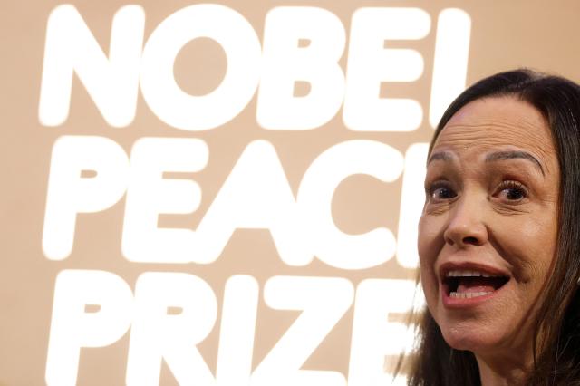 Nobel peace prize laureate Maria Corina Machado addresses a press conference at the Grand Hotel in Oslo, Norway, on December 11, 2025. The 58-year-old, who has been in hiding in her home country since June 2024, missed the award of the Nobel Prize in Oslo on December 10. But she waved to supporters from her hotel shortly after arriving during the night. Maria Corina Machado is the lynchpin of opposition to Venezuelan President Nicolas Maduro's regime, a fearless activist with rock star appeal whose inability to attend her own Nobel prize ceremony underlined the dangers she faces. (Photo by Odd ANDERSEN / AFP)