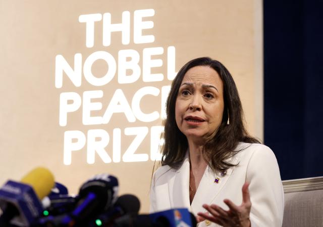 Nobel peace prize laureate Maria Corina Machado addresses a press conference at the Grand Hotel in Oslo, Norway, on December 11, 2025. The 58-year-old, who has been in hiding in her home country since June 2024, missed the award of the Nobel Prize in Oslo on December 10. But she waved to supporters from her hotel shortly after arriving during the night. Maria Corina Machado is the lynchpin of opposition to Venezuelan President Nicolas Maduro's regime, a fearless activist with rock star appeal whose inability to attend her own Nobel prize ceremony underlined the dangers she faces. (Photo by Odd ANDERSEN / AFP)