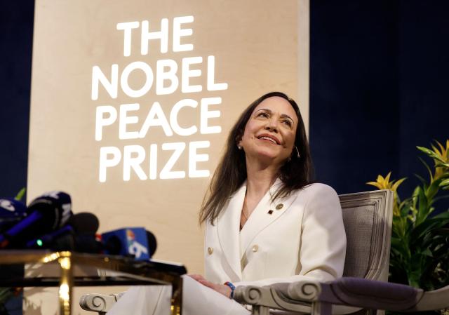 Nobel peace prize laureate Maria Corina Machado addresses a press conference at the Grand Hotel in Oslo, Norway, on December 11, 2025. The 58-year-old, who has been in hiding in her home country since June 2024, missed the award of the Nobel Prize in Oslo on December 10. But she waved to supporters from her hotel shortly after arriving during the night. Maria Corina Machado is the lynchpin of opposition to Venezuelan President Nicolas Maduro's regime, a fearless activist with rock star appeal whose inability to attend her own Nobel prize ceremony underlined the dangers she faces. (Photo by Odd ANDERSEN / AFP)