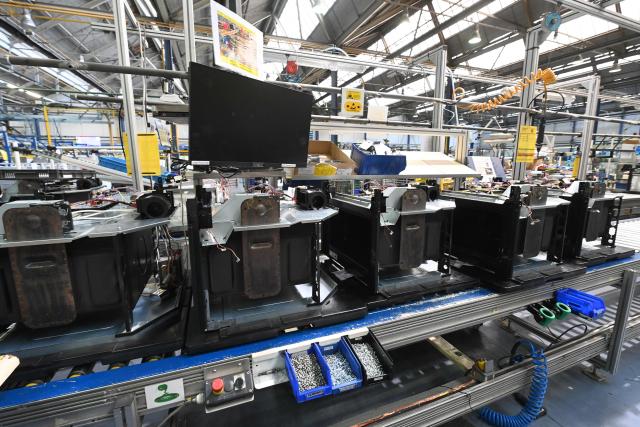This photo shows an interior view of a Brandt factory at a standstill with an oven assembly line following the announcement of the group's immediate liquidation in Vendome, western France, on December 11, 2025. On December 11, 2025, the courts ordered the liquidation of the century-old household appliance group Brandt, a French industrial flagship that is disappearing, leaving some 700 employees unemployed on the eve of Christmas, some of whom gathered at midday to express their “anger.” (Photo by JEAN-FRANCOIS MONIER / AFP)