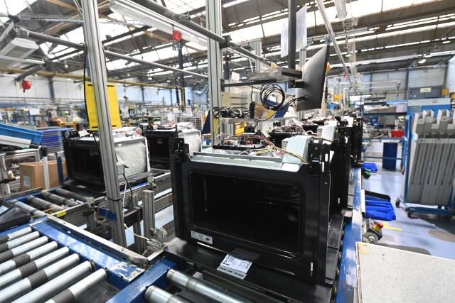 This photo shows an interior view of a Brandt factory at a standstill with an oven assembly line following the announcement of the group's immediate liquidation in Vendome, western France, on December 11, 2025. On December 11, 2025, the courts ordered the liquidation of the century-old household appliance group Brandt, a French industrial flagship that is disappearing, leaving some 700 employees unemployed on the eve of Christmas, some of whom gathered at midday to express their “anger.” (Photo by JEAN-FRANCOIS MONIER / AFP)
