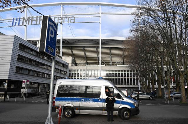 Police officers patrol in front of the MHP-Arena prior to the UEFA Europa League football match between VfB Stuttgart and Maccabi Tel Aviv in Stuttgart, southern Germany, on December 11, 2025. (Photo by THOMAS KIENZLE / AFP)
