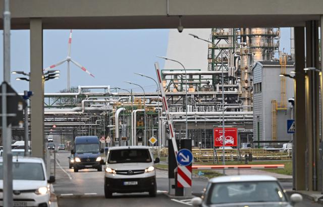 Picture taken on December 11, 2025 shows the PCK refinery, which supplies oil to Berlin and the surrounding region, in Schwedt, northeastern Germany. A damage at a pipeline of the major PCK refinery resulted in a "large oil spill", a spokesman for Brandenburg's environment ministry said. The PCK refinery near the border with Poland is majority-owned by Rosneft Deutschland, a local subsidiary of the Russian oil giant, and managed through a trusteeship by the German government. While no one was seriously injured as a result of the spill, an environment ministry spokesperson said the crude may have entered local rivers. (Photo by RALF HIRSCHBERGER / AFP)