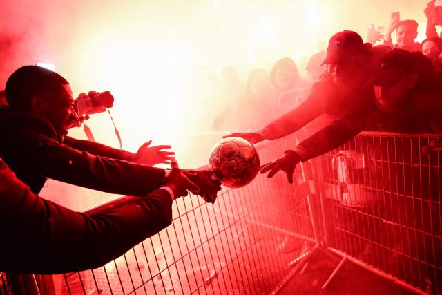 AFP PICTURES OF THE YEAR 2025

Paris Saint-Germain's French forward Ousmane Dembele celebrates with supporters after receiving the Ballon d'Or award at the end of the 2025 Ballon d'Or France Football award ceremony outside the Theatre du Chatelet in Paris on September 22, 2025. (Photo by FRANCK FIFE / AFP) / AFP PICTURES OF THE YEAR 2025