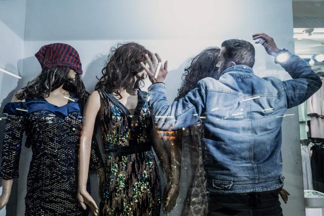 AFP PICTURES OF THE YEAR 2025

This photograph taken on March 13, 2025 shows an Afghan shopkeeper adjusting women's wigs placed on mannequins at his shop in Kabul.. Until Taliban authorities took power in Afghanistan women like Fatima were able to freely sell their hair to be made into wigs, bringing in crucial cash. Last year Taliban authorities imposed vice and virtue laws regulating everyday life for men and women, including banning sales of "any part of the human body" including hair. (Photo by Wakil KOHSAR / AFP) / AFP PICTURES OF THE YEAR 2025