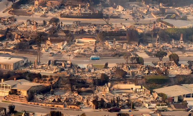AFP PICTURES OF THE YEAR 2025

In this aerial view taken from a helicopter a blue van sits intact amid burned homes seen from above during the Palisades fire near the Pacific Palisades neighborhood of Los Angeles, California on January 9, 2025.. Massive wildfires that engulfed whole neighborhoods and displaced thousands in Los Angeles remained totally uncontained January 9, 2025, authorities said, as US National Guard soldiers readied to hit the streets to help quell disorder. Swaths of the United States' second-largest city lay in ruins, with smoke blanketing the sky and an acrid smell pervading almost every building. (Photo by JOSH EDELSON / AFP) / AFP PICTURES OF THE YEAR 2025