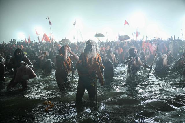 EDITORS NOTE: Graphic content / AFP PICTURES OF THE YEAR 2025

Naga Sadhus or Hindu holy men take a dip in Sangam, the confluence of Ganges, Yamuna and mythical Saraswati rivers, during Shahi Snan or 'royal bath', to mark the Maha Kumbh Mela festival, in Prayagraj on January 14, 2025.. Vast crowds of Hindu pilgrims in India bathed in sacred waters as the Kumbh Mela festival opened on January 13, with organisers expecting 400 million people -- the world's largest gathering of humanity -- to assemble over six weeks. (Photo by Idrees MOHAMMED / AFP) / AFP PICTURES OF THE YEAR 2025