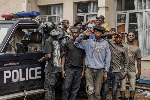 AFP PICTURES OF THE YEAR 2025

A group of prospective police recruits, ready to be enrolled in the M23 controlled force, salute in the courtyard of a police station in Goma on February 6, 2025.. More than a week after the battle for the North Kivu provincial capital, the M23 on Wednesday appointed people to public positions. Goma now has two officials for many public posts -- two mayors, two governors -- which locals said has created confusion. The M23 administration is still in its embryonic stages and struggling to respond to daily problems in the war-wounded city. (Photo by Michel Lunanga / AFP) / AFP PICTURES OF THE YEAR 2025