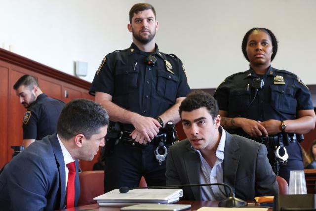 Luigi Mangione (R) appears in Manhattan Supreme Court during an evidentiary hearing in the murder case of United Healthcare CEO Brian Thompson, in New York, on December 11, 2025. (Photo by William Farrington / POOL / AFP)