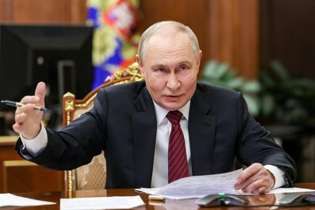 In this pool photograph distributed by Russian state agency Sputnik, Russia's President Vladimir Putin gestures as he attends a meeting regarding the situation in the area of the so-called "special military operation" in Ukraine with Russian military officials via video link in Moscow on December 11, 2025. Russia said on December 11, 2025 its troops had seized full control of Siversk, a Ukrainian city in the eastern Donetsk region, one of the key settlements where fighting has intensified in recent weeks. (Photo by Gavriil GRIGOROV / POOL / AFP)