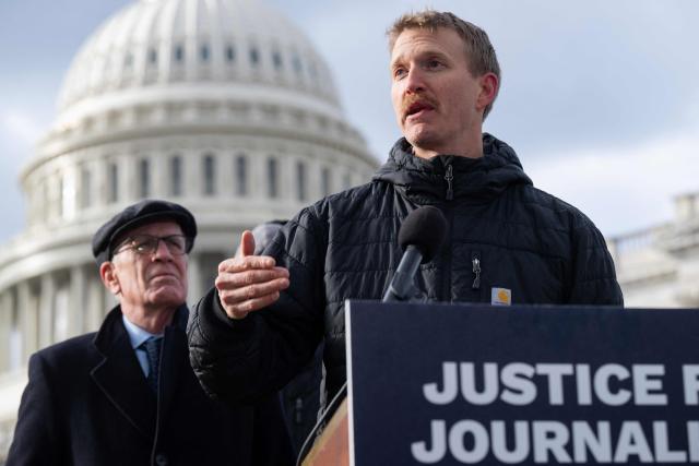 Agence France-Presse (AFP) video journalist Dylan Collins speaks about his experience being wounded during an Israeli attack on a group of seven journalists in Southern Lebanon on October 13, 2023, alongside US Senator Peter Welch (L), Democrat of Vermont, as members of Congress, along with Amnesty International USA and the Committee to Protect Journalists, present their findings into the attack, during a press conference outside the US Capitol in Washington, DC, December 11, 2025. A Reuters video journalist was killed in the strike and an AFP photojournalist was gravely wounded, resulting in the amputation of her right leg. (Photo by SAUL LOEB / AFP)