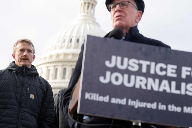 US Senator Peter Welch (R), Democrat of Vermont, speaks alongside Agence France-Presse (AFP) video journalist Dylan Collins (L), who was wounded during an Israeli attack on a group of seven journalists in Southern Lebanon on October 13, 2023, as members of Congress, along with Amnesty International USA and the Committee to Protect Journalists, present their findings into the attack, during a press conference outside the US Capitol in Washington, DC, December 11, 2025. A Reuters video journalist was killed in the strike and an AFP photojournalist was gravely wounded, resulting in the amputation of her right leg. (Photo by SAUL LOEB / AFP)