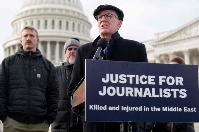 US Senator Peter Welch (R), Democrat of Vermont, speaks alongside Agence France-Presse (AFP) video journalist Dylan Collins (L), who was wounded during an Israeli attack on a group of seven journalists in Southern Lebanon on October 13, 2023, as members of Congress, along with Amnesty International USA and the Committee to Protect Journalists, present their findings into the attack, during a press conference outside the US Capitol in Washington, DC, December 11, 2025. A Reuters video journalist was killed in the strike and an AFP photojournalist was gravely wounded, resulting in the amputation of her right leg. (Photo by SAUL LOEB / AFP)