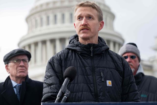 Agence France-Presse (AFP) video journalist Dylan Collins speaks about his experience being wounded during an Israeli attack on a group of seven journalists in Southern Lebanon on October 13, 2023, alongside US Senator Peter Welch (L), Democrat of Vermont, as members of Congress, along with Amnesty International USA and the Committee to Protect Journalists, present their findings into the attack, during a press conference outside the US Capitol in Washington, DC, December 11, 2025. A Reuters video journalist was killed in the strike and an AFP photojournalist was gravely wounded, resulting in the amputation of her right leg. (Photo by SAUL LOEB / AFP)