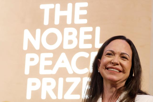 TOPSHOT - Nobel peace prize laureate Maria Corina Machado addresses a press conference at the Grand Hotel in Oslo, Norway, on December 11, 2025. - The 58-year-old, who has been in hiding in her home country since June 2024, missed the award of the Nobel Prize in Oslo on December 10. But she waved to supporters from her hotel shortly after arriving during the night. Maria Corina Machado is the lynchpin of opposition to Venezuelan President Nicolas Maduro's regime, a fearless activist with rock star appeal whose inability to attend her own Nobel prize ceremony underlined the dangers she faces. (Photo by Odd ANDERSEN / AFP)