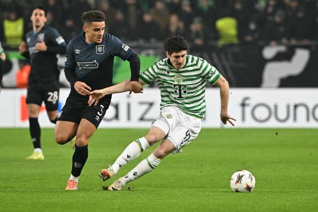Glasgow Rangers' English defender #03 Max Aarons (L) Ferencvaros' Irish midfielder #47 Callum O'Dowda vie for the ball during the UEFA Europa League football match between Ferencvaros TC and Rangers in Budapest on December 11, 2025. (Photo by Attila KISBENEDEK / AFP)