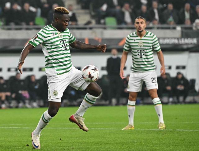 Ferencvaros' Nigerian forward #11 Bamidele Yusuf (L) plays the ball during the UEFA Europa League football match between Ferencvarosi TC and Rangers in Budapest on December 11, 2025. (Photo by Attila KISBENEDEK / AFP)