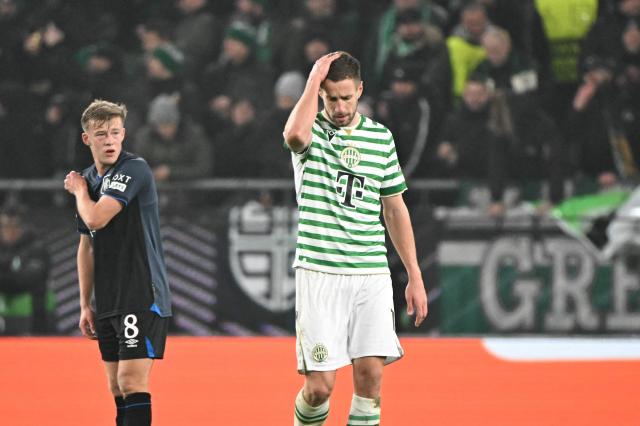 Glasgow Rangers' Scottish midfielder #08 Connor Barron (L) and Ferencvaros' Hungarian forward #19 Barnabas Varga react during the UEFA Europa League football match between Ferencvarosi TC and Rangers in Budapest on December 11, 2025. (Photo by Attila KISBENEDEK / AFP)