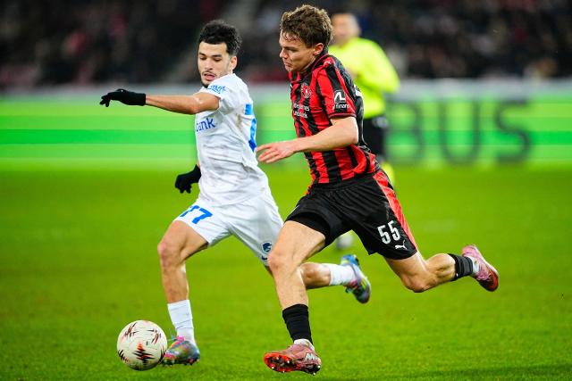 RC Genk's Moroccan midfielder #77 Zakaria El Ouahdi and Midtjylland's Danish defender #55 Victor Bak Jesen vie for the ball during the UEFA Europa League football match between FC Midtjylland and RC Genk in Herning, Denmark on December 11, 2025. (Photo by Bo Amstrup / Ritzau Scanpix / AFP) / Denmark OUT