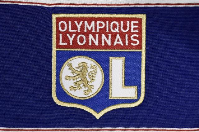 (FILES) This photo taken on August 6, 2015 in Paris, shows a partial view of a Olympique Lyonnais (OL) football team jersey. Olympique Lyonnais will be subject to payroll expenditure restrictions and strict supervision of its recruitment in the next transfer window, imposed by the DNCG of the Professional Football League (Ligue de Football Professionnel) it was announced on December 11, 2025. (Photo by Franck FIFE / AFP)