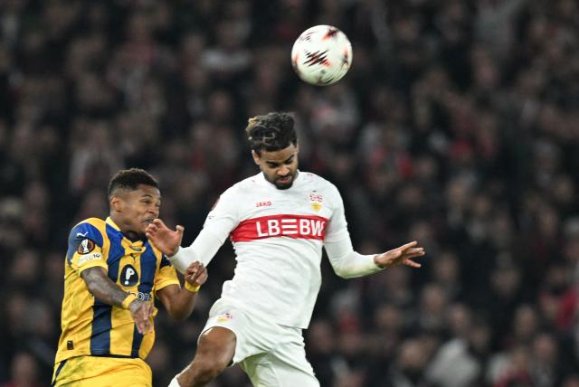 Maccabi Tel Aviv's Cape Verdean forward #29 Helio Varela and Stuttgart's French defender #22 Lorenz Assignon vie for the ball during the UEFA Europa League football match between VfB Stuttgart and Maccabi Tel Aviv in Stuttgart, southern Germany, on December 11, 2025. (Photo by THOMAS KIENZLE / AFP)