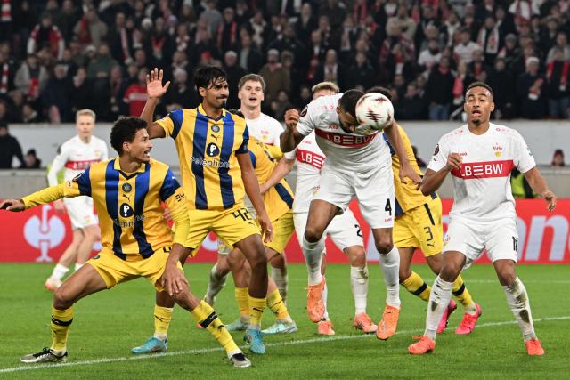 Stuttgart's German defender #04 Josha Vagnoman heads the ball to score his team's 4:0 during the UEFA Europa League football match between VfB Stuttgart and Maccabi Tel Aviv in Stuttgart, southern Germany, on December 11, 2025. (Photo by THOMAS KIENZLE / AFP)