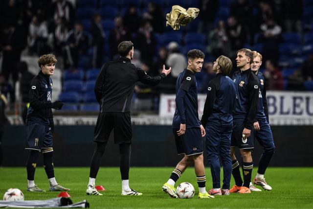 Go Ahead Eagles players warm up ahead of the UEFA Europa League, league phase, football match between Olympique Lyonnais (OL) and Go Ahead Eagles at the Groupama Stadium in Decines-Charpieu, central-eastern France, on December 11, 2025. (Photo by JEFF PACHOUD / AFP)
