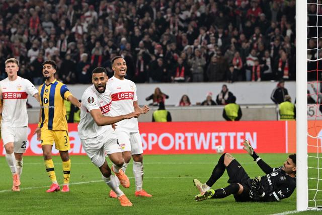 Stuttgart's German defender #04 Josha Vagnoman celebrates after scoring his team's 4:0 during the UEFA Europa League football match between VfB Stuttgart and Maccabi Tel Aviv in Stuttgart, southern Germany, on December 11, 2025. (Photo by THOMAS KIENZLE / AFP)