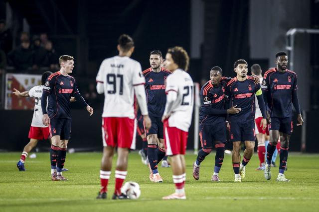 Nottingham Forest players celebrate their team's second goal during the UEFA Europa League, league phase day 6, football match between FC Utrecht and Nottingham Forest, at the Galgenwaard Stadium in Utrecht on December 11, 2025. (Photo by Robin VAN LONKHUIJSEN / ANP / AFP) / Netherlands OUT