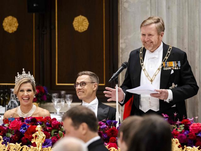 King Willem-Alexander (R) delivers a speech next to Queen Maxima (L) and Finland's president Alexander Stubb  during a state diner at the Royal Palace in Amsterdam on the first day of Stubb's two-day state visit to the Netherlands. (Photo by Remko de Waal / ANP / AFP) / Netherlands OUT